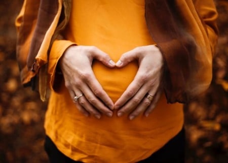 Pregnant belly with hands