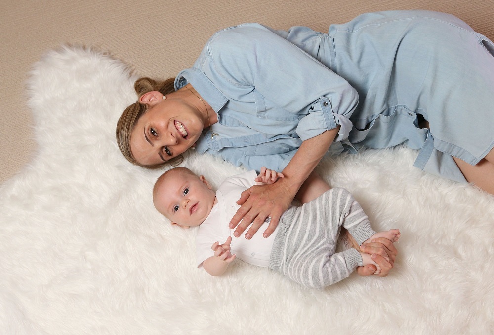 Mother and baby on rug